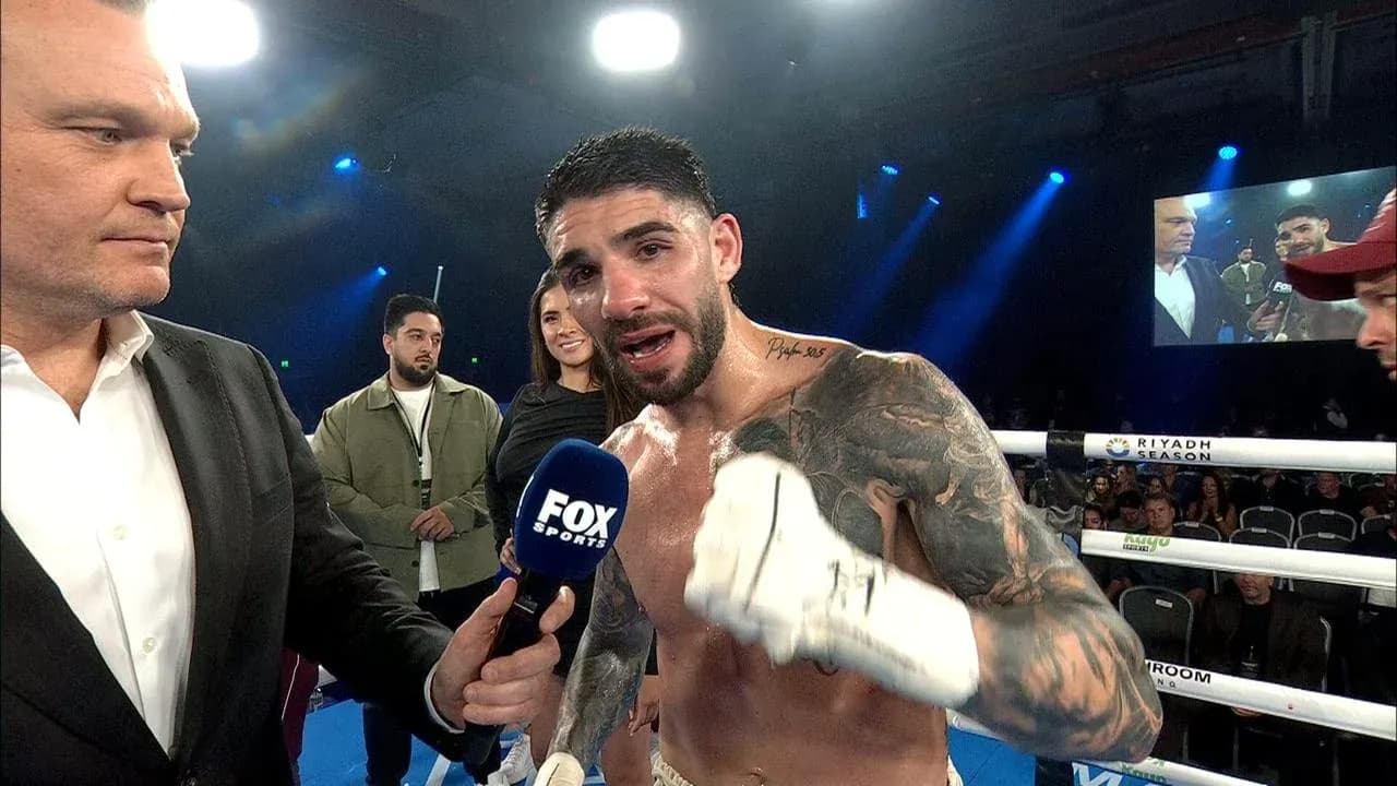 Boxer speaking into microphone after match Boxer speaking into microphone after match