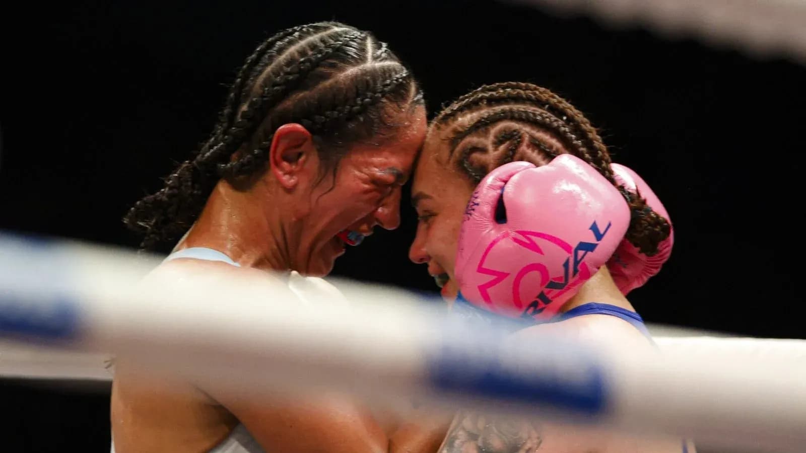 Duo of boxers embracing in the ring Duo of boxers embracing in the ring