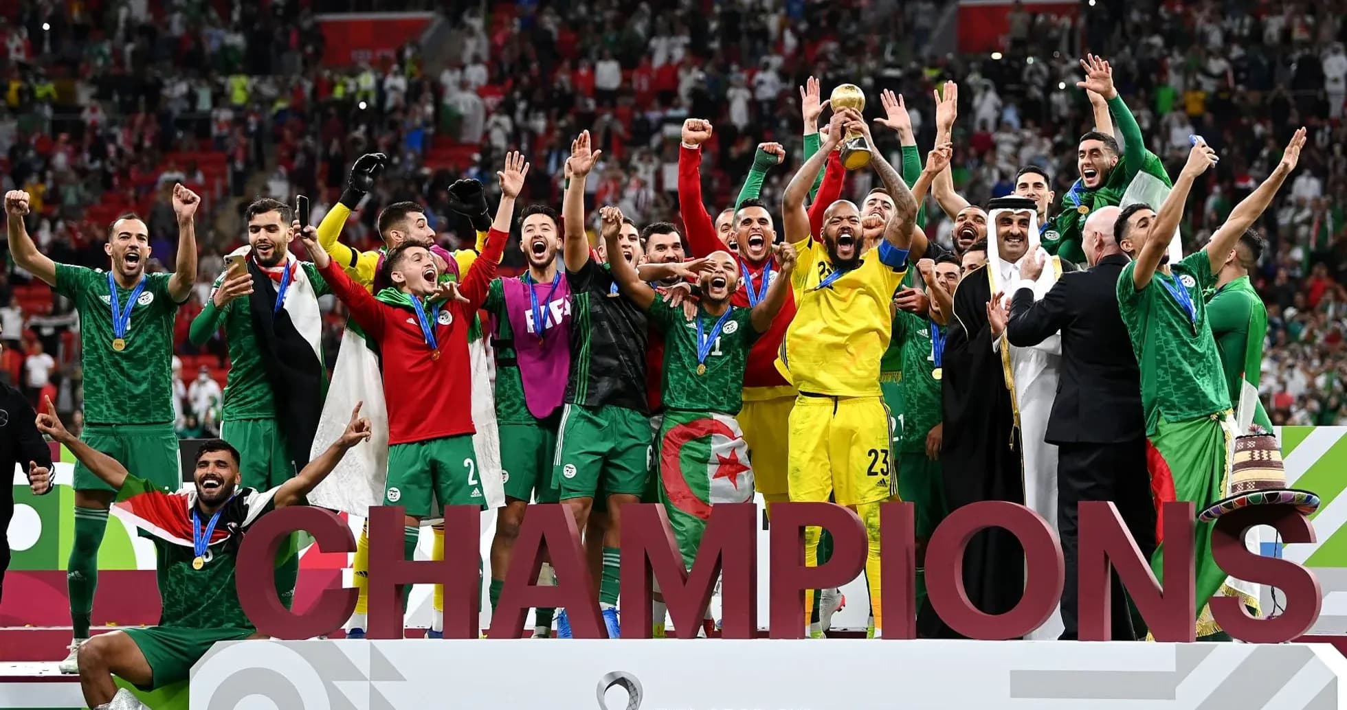Algeria team celebrating victory with trophy Algeria team celebrating victory with trophy