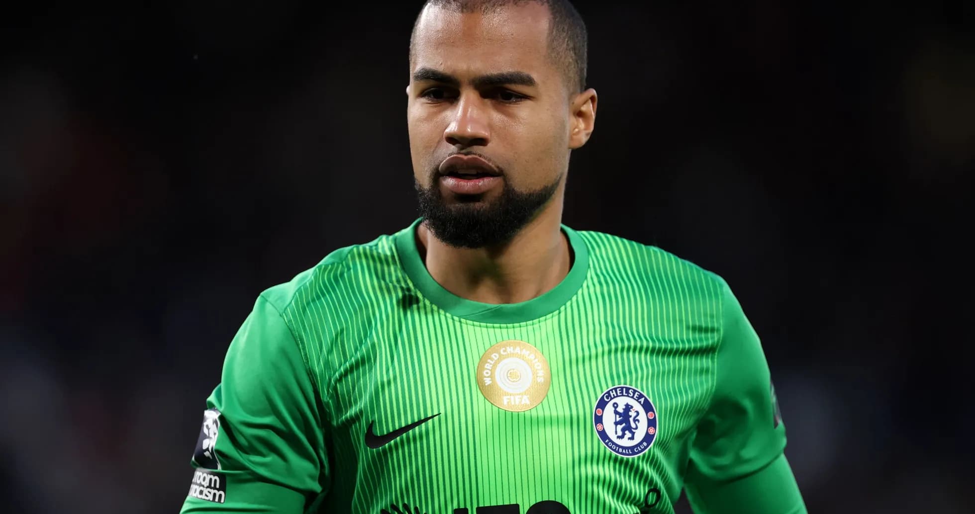 Goalkeeper in green kit during match preparation Goalkeeper in green kit during match preparation