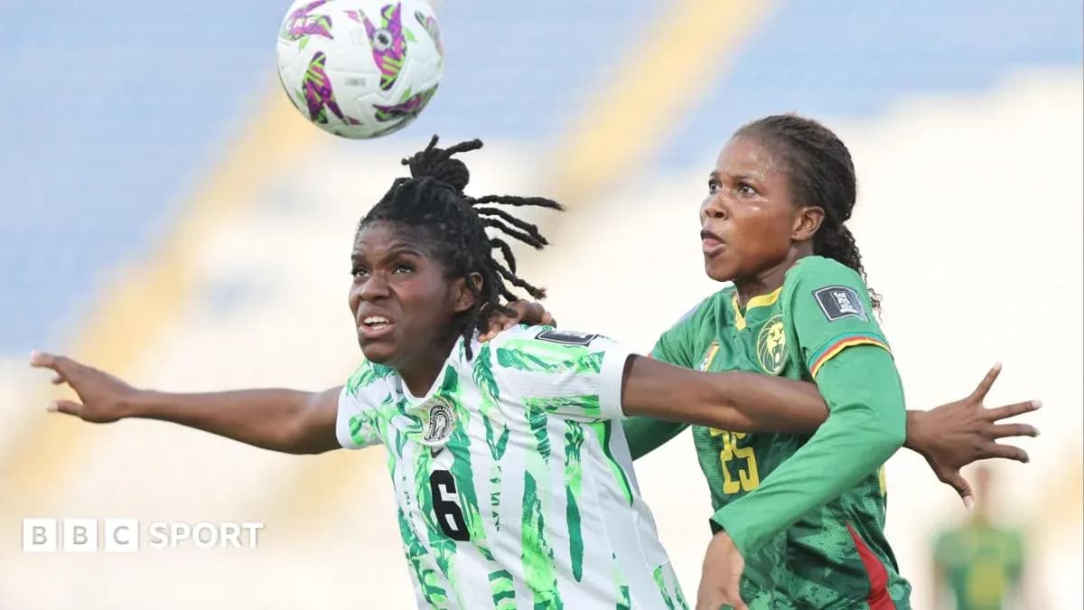 Two players challenging for the ball in match Two players challenging for the ball in match