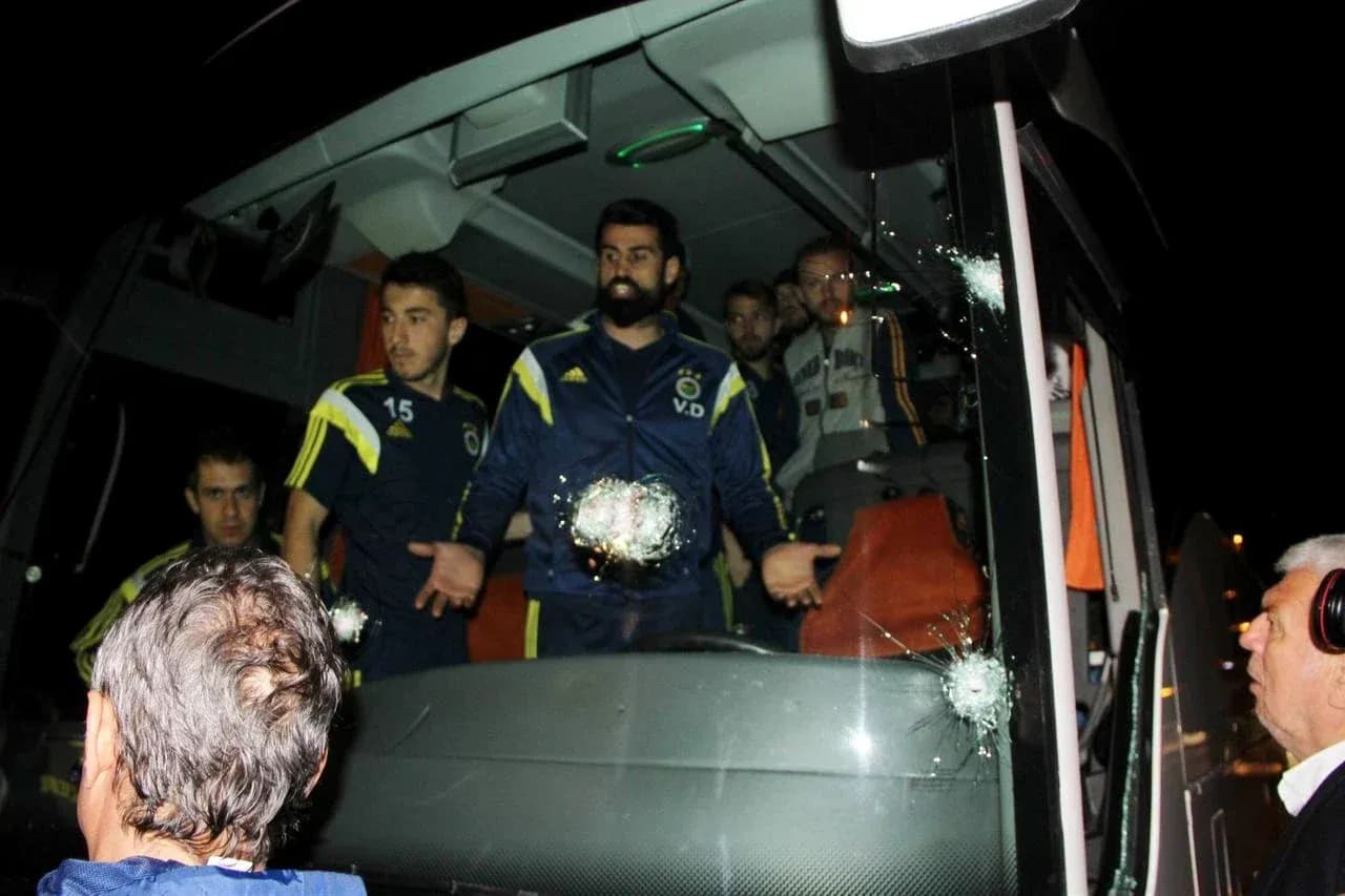 Fenerbahçe players on team bus with bullet holes Fenerbahçe players on team bus with bullet holes