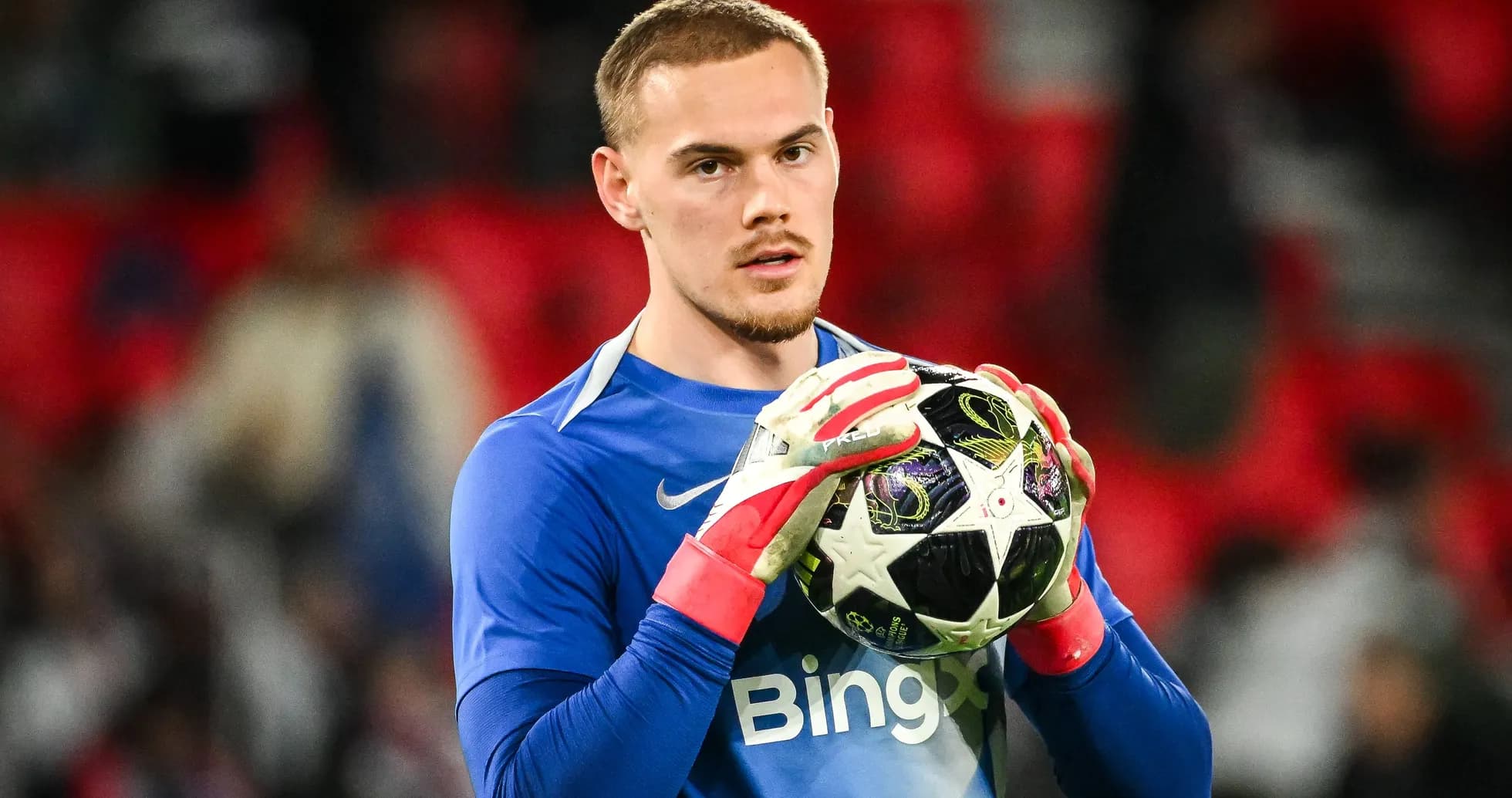 Goalkeeper holding a football before the match Goalkeeper holding a football before the match