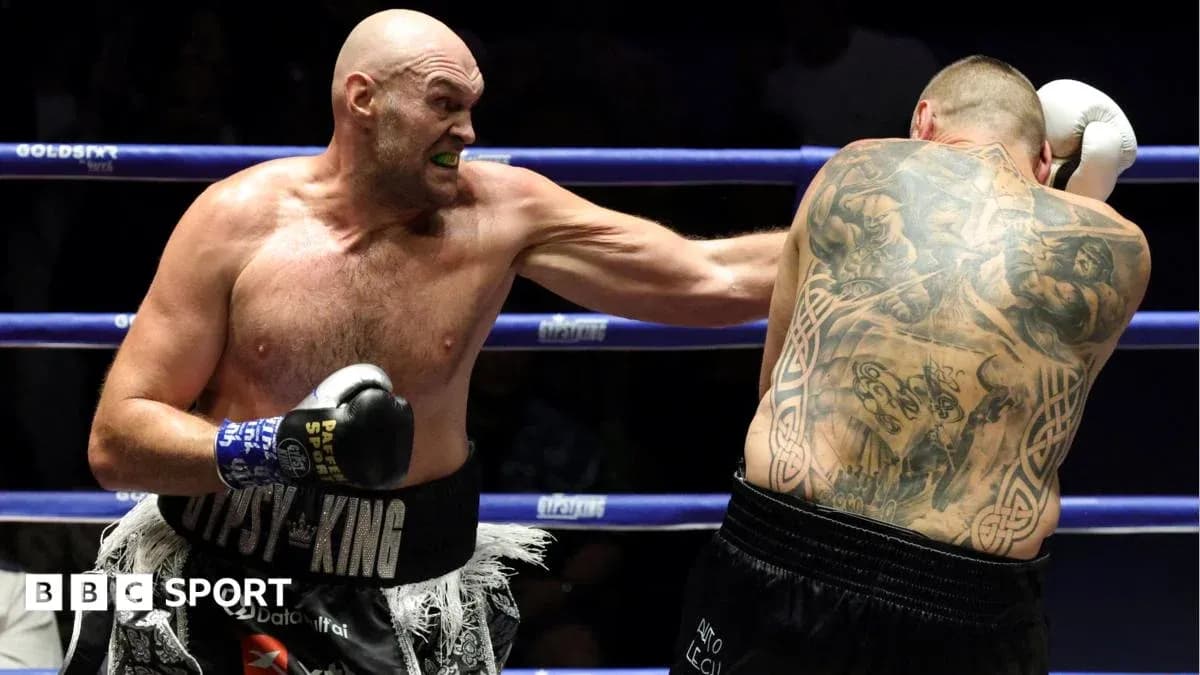Tyson Fury throwing a punch during boxing match Tyson Fury throwing a punch during boxing match