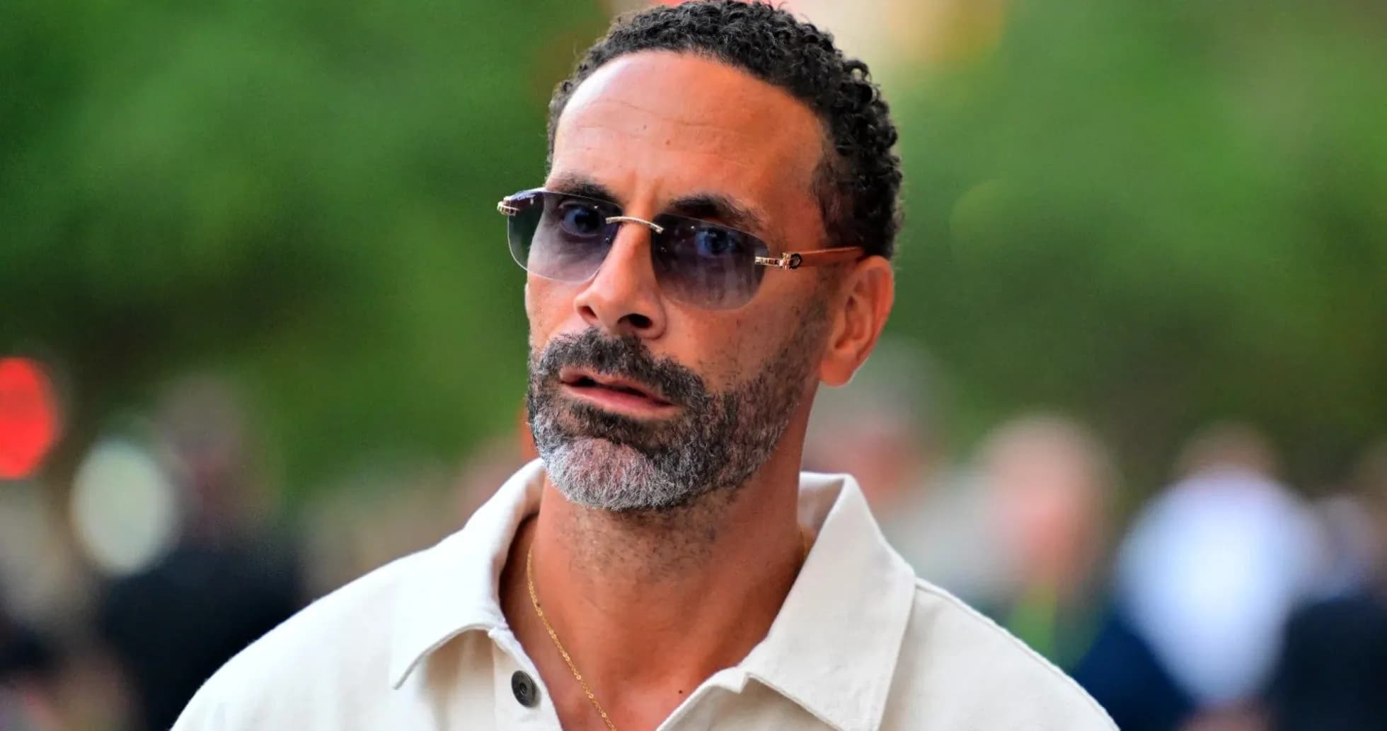 Man wearing sunglasses in outdoor setting Man wearing sunglasses in outdoor setting