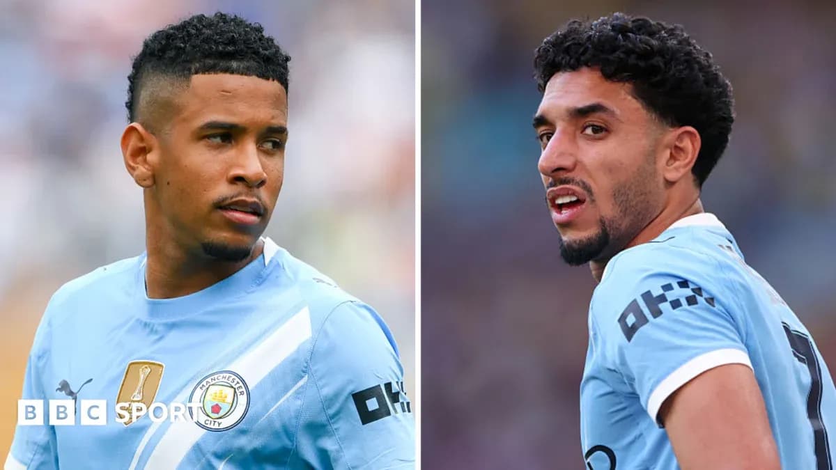 Two Manchester City players in match kits Two Manchester City players in match kits