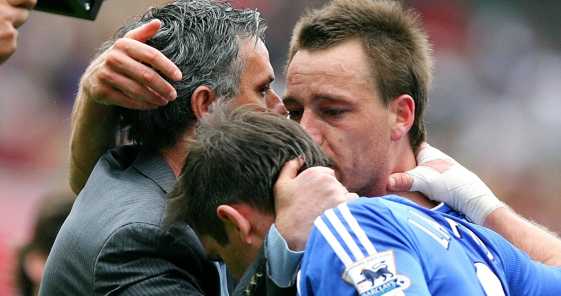 Coaches and players embracing after match conclusion Coaches and players embracing after match conclusion