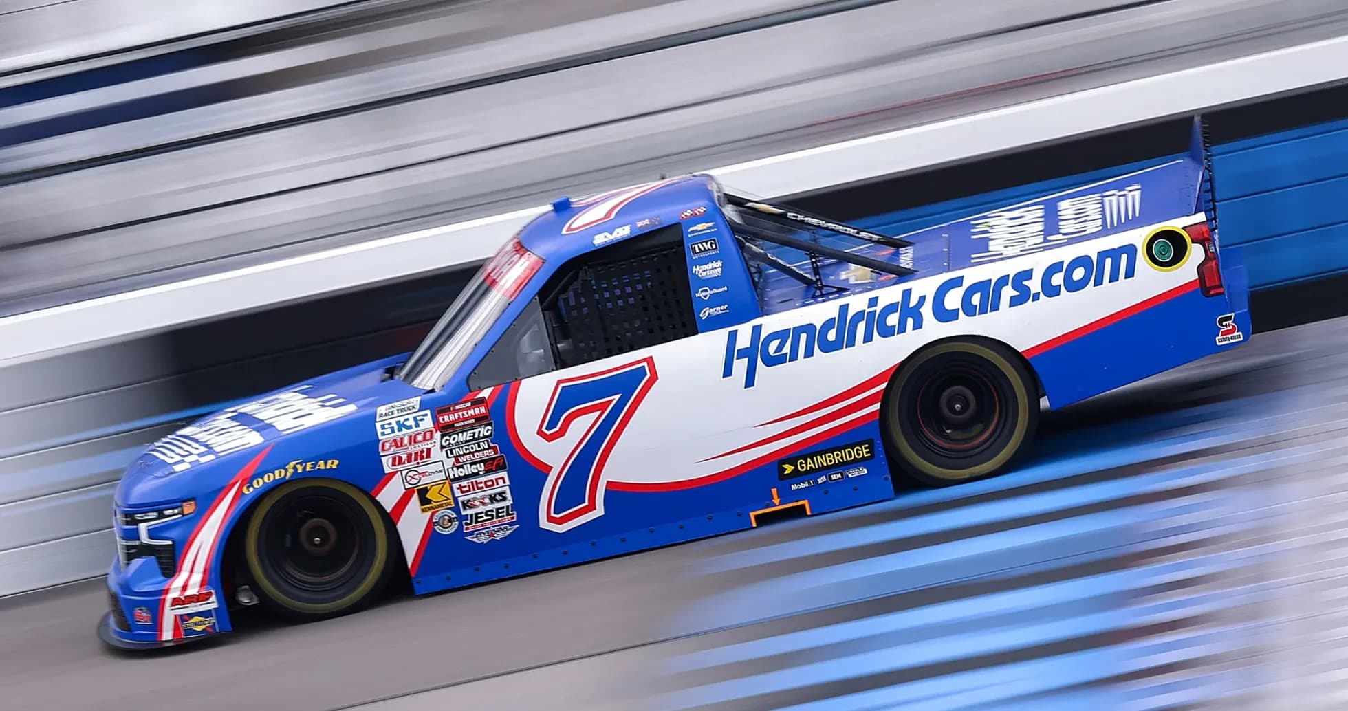 NASCAR truck racing on track during event NASCAR truck racing on track during event