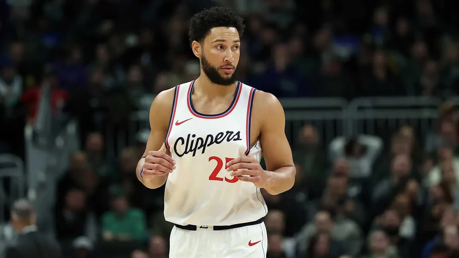 Basketball player in Clippers jersey on court Basketball player in Clippers jersey on court