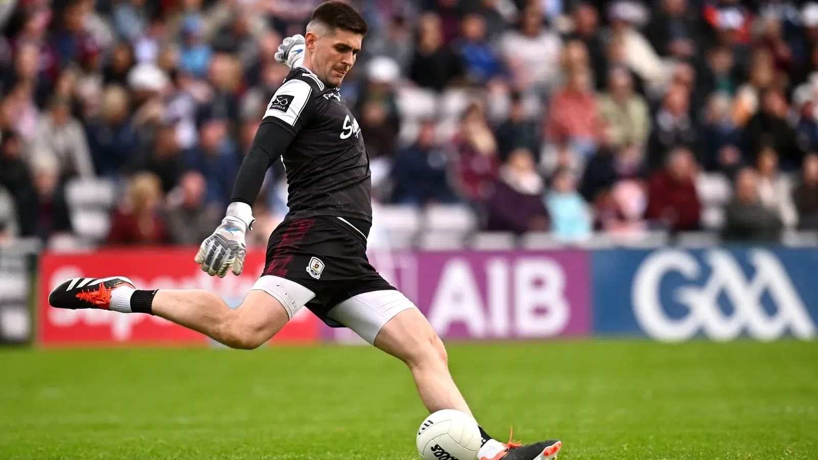 Goalkeeper kicking ball during a match Goalkeeper kicking ball during a match
