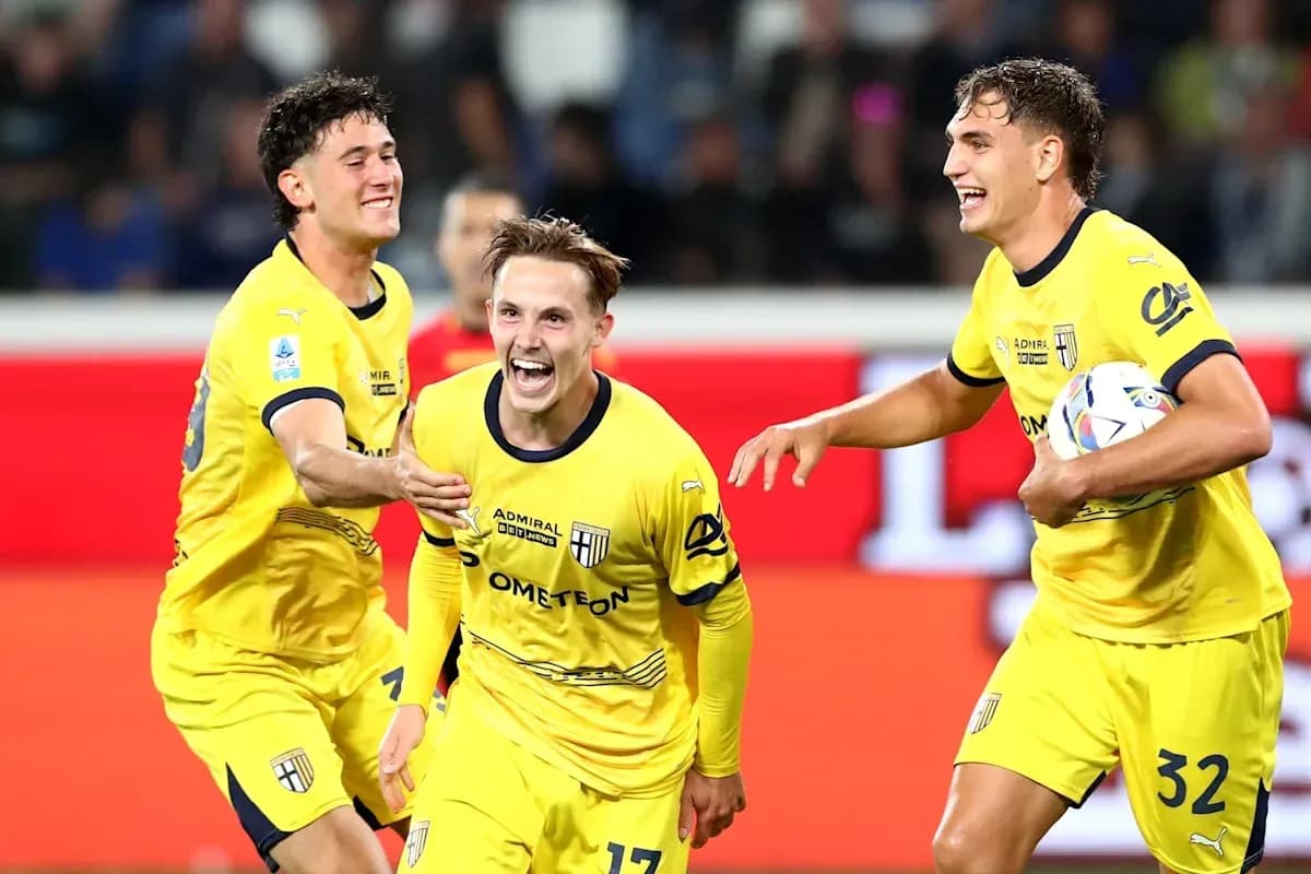 Parma players celebrating a goal during a match Parma players celebrating a goal during a match