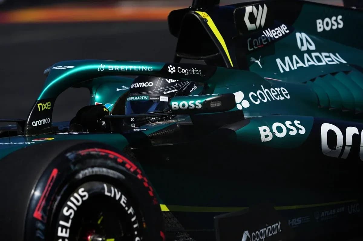 Formula 1 car during a race with driver visible Formula 1 car during a race with driver visible