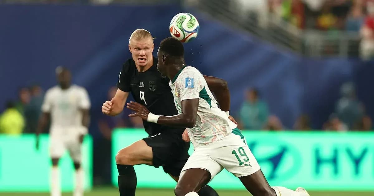 Two players contesting for the ball during match Two players contesting for the ball during match