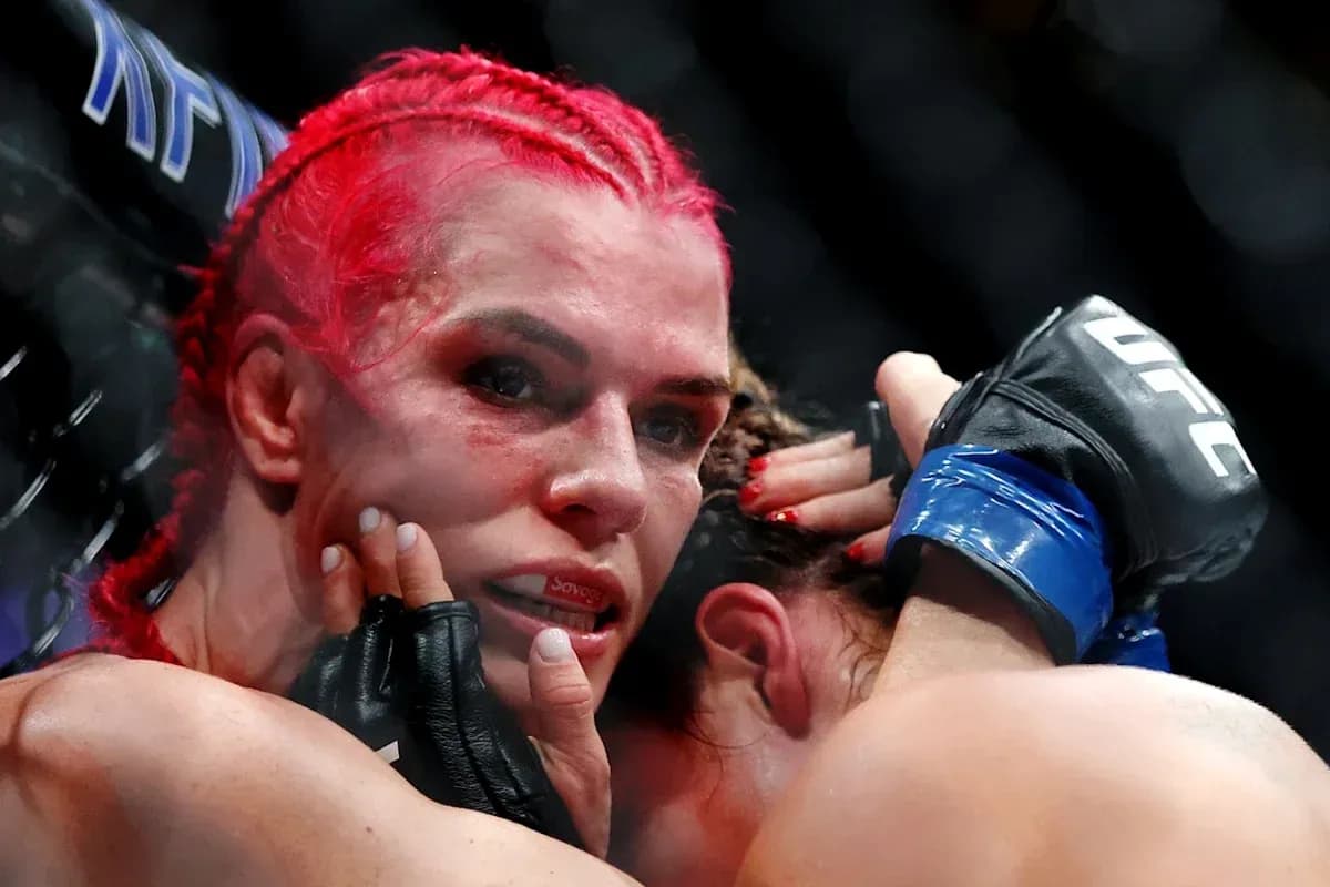 Fighters grappling in UFC match inside the octagon Fighters grappling in UFC match inside the octagon