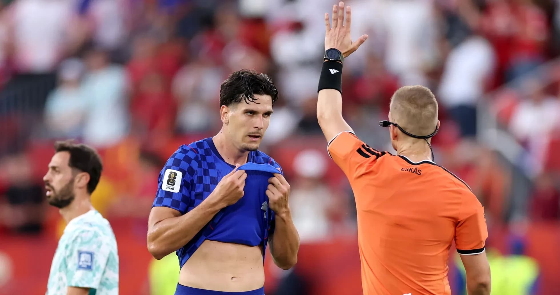 Referee showing card to player during match Referee showing card to player during match
