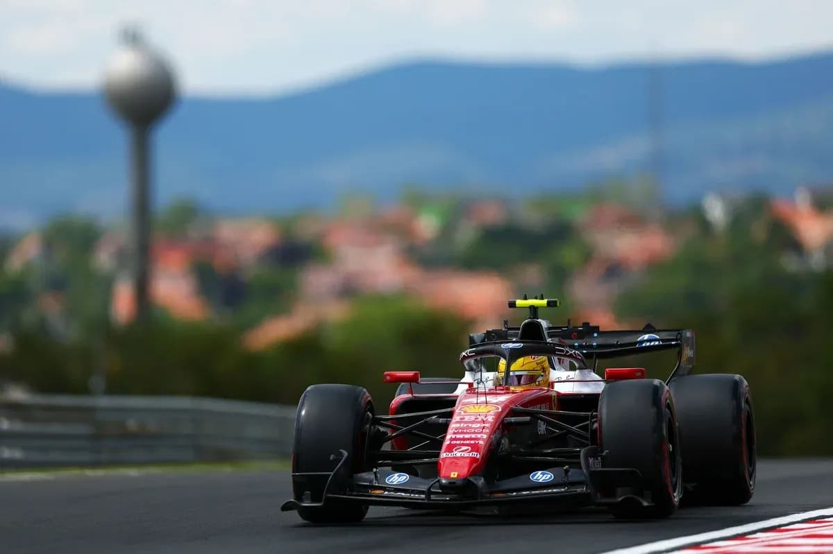 Formula 1 car racing on track with city background Formula 1 car racing on track with city background
