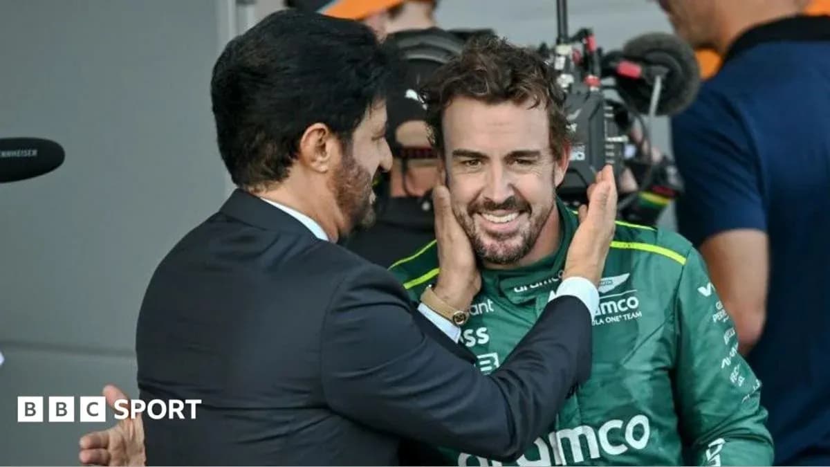 Fernando Alonso celebrating with team representative after race Fernando Alonso celebrating with team representative after race