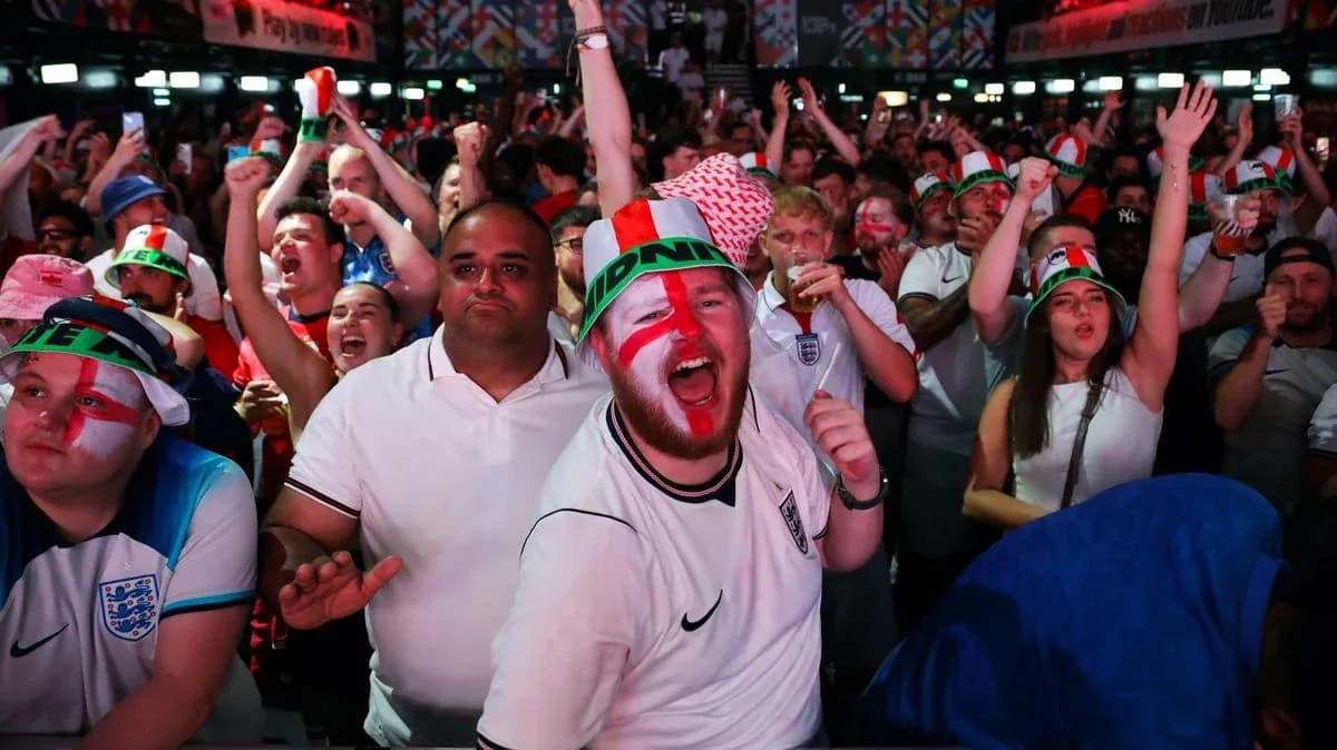 Football fans celebrating in crowded venue with flags Football fans celebrating in crowded venue with flags