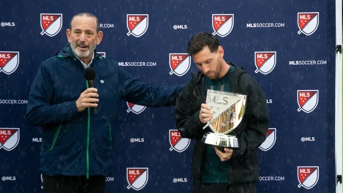 Lionel Messi holding MLS trophy during presentation Lionel Messi holding MLS trophy during presentation
