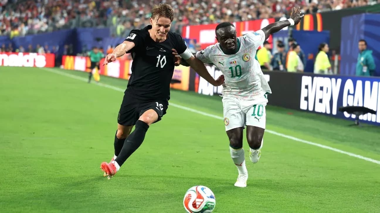 Two players contesting the ball during a match Two players contesting the ball during a match