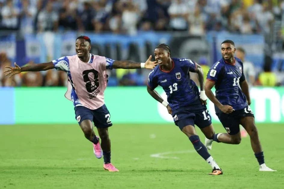 Jubilant players celebrating a goal on field Jubilant players celebrating a goal on field