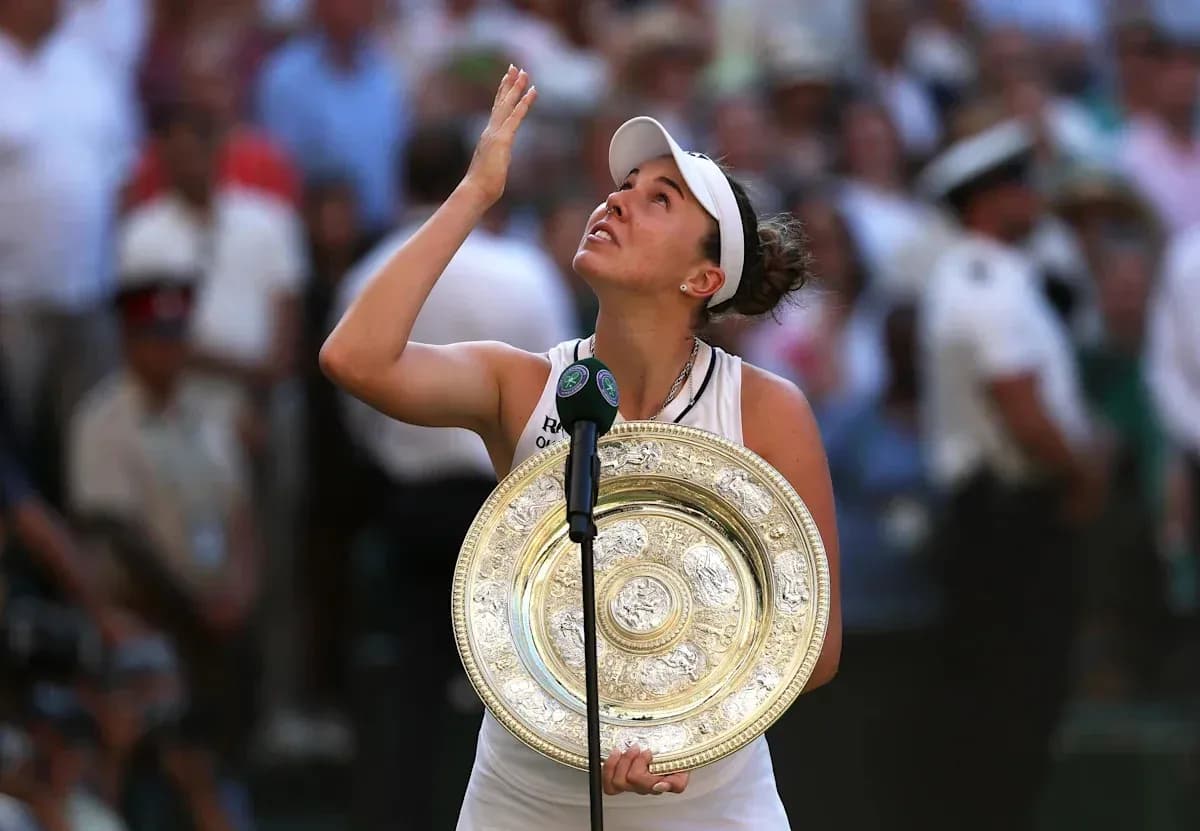 Tennis player holding Wimbledon trophy after victory Tennis player holding Wimbledon trophy after victory