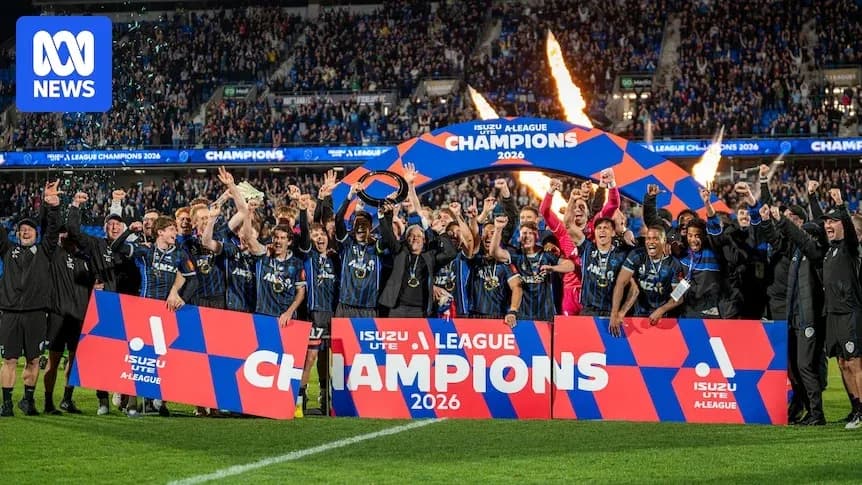 Football team celebrating A-League championship victory Football team celebrating A-League championship victory