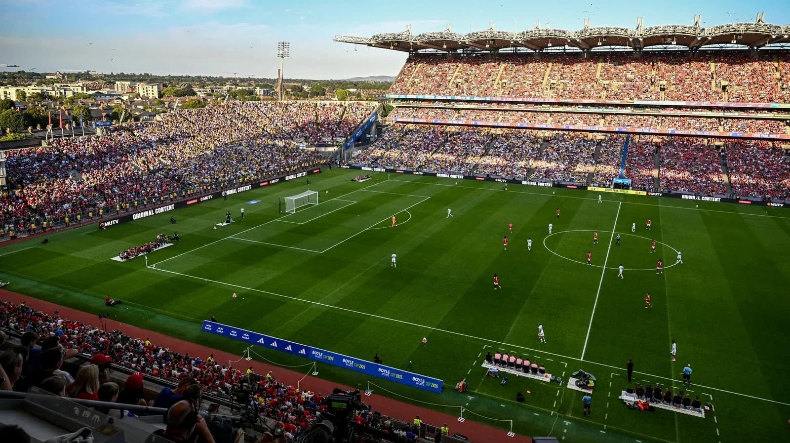 Stadium filled with fans during a football match Stadium filled with fans during a football match