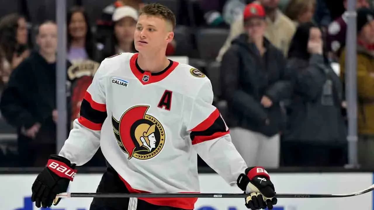 Hockey player in Senators jersey on the ice Hockey player in Senators jersey on the ice