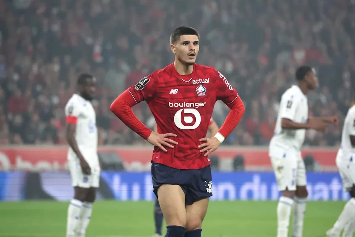 Lille player standing with hands on hips during match Lille player standing with hands on hips during match