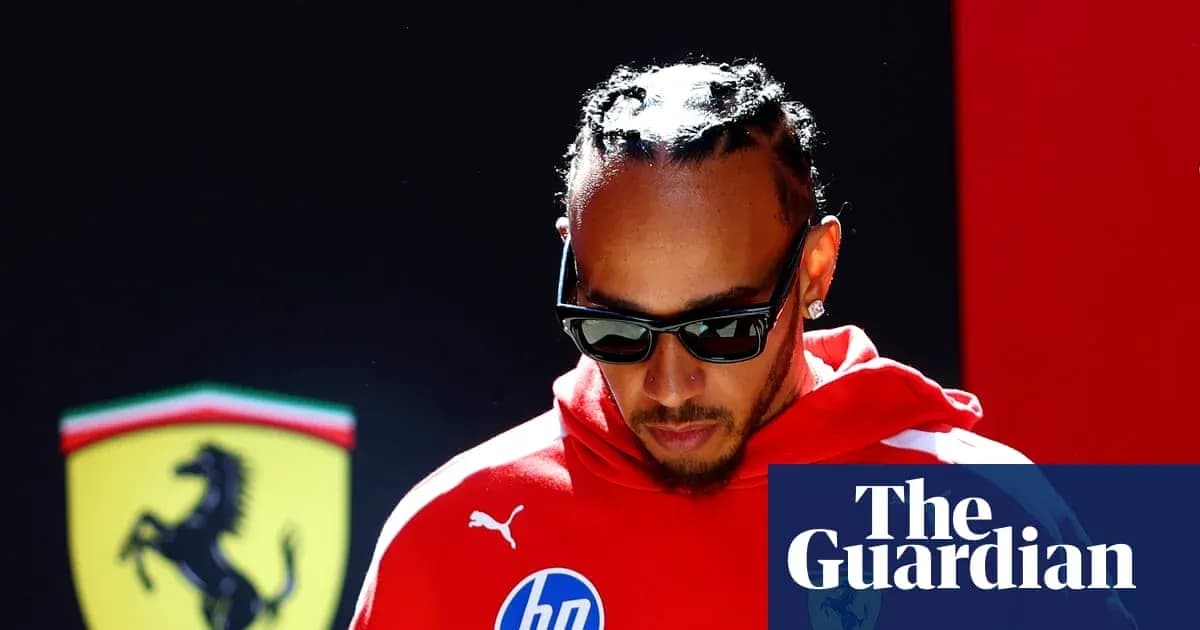 Formula 1 driver in red attire before event Formula 1 driver in red attire before event