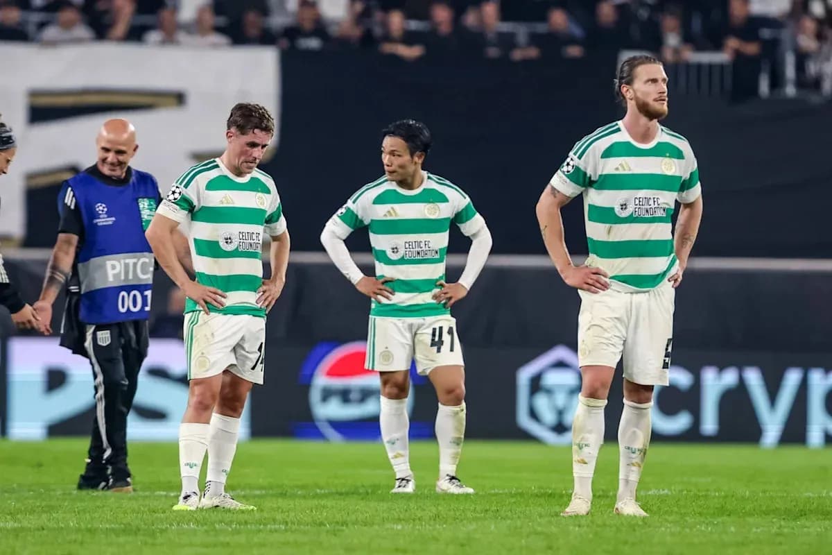 Celtic FC players standing dejected after match Celtic FC players standing dejected after match