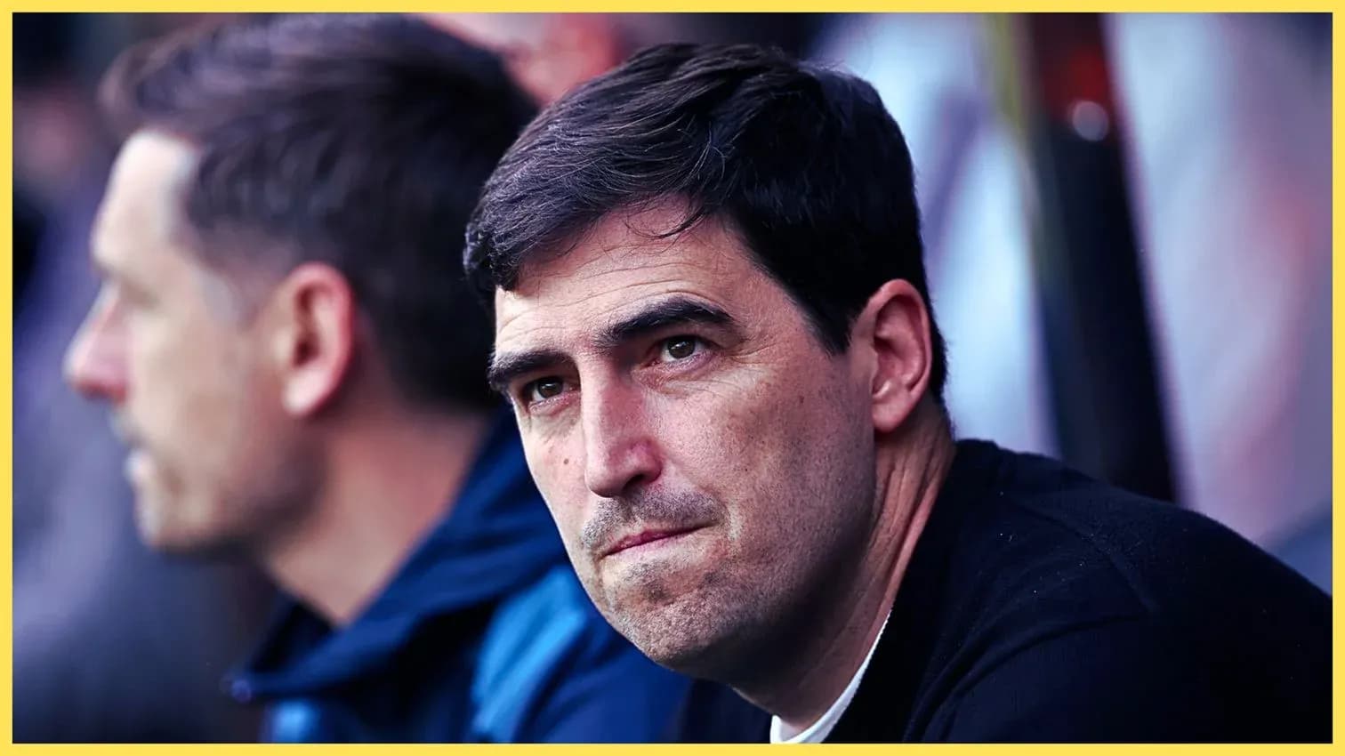 Football manager observing from the sidelines Football manager observing from the sidelines