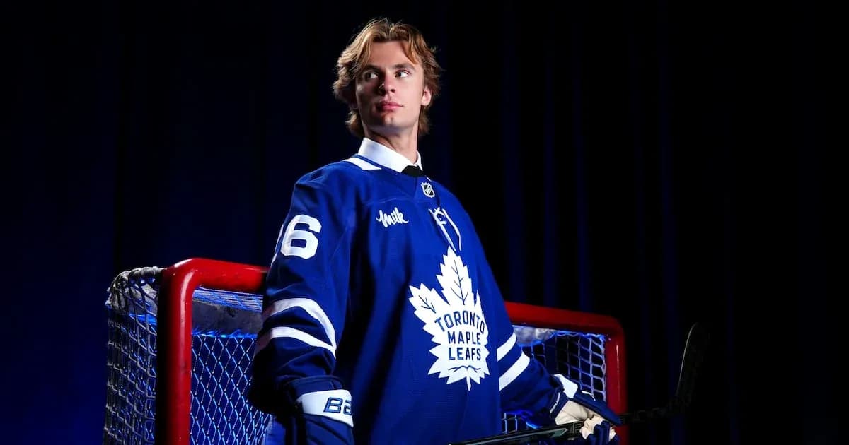 Hockey player in Toronto Maple Leafs jersey near goal Hockey player in Toronto Maple Leafs jersey near goal