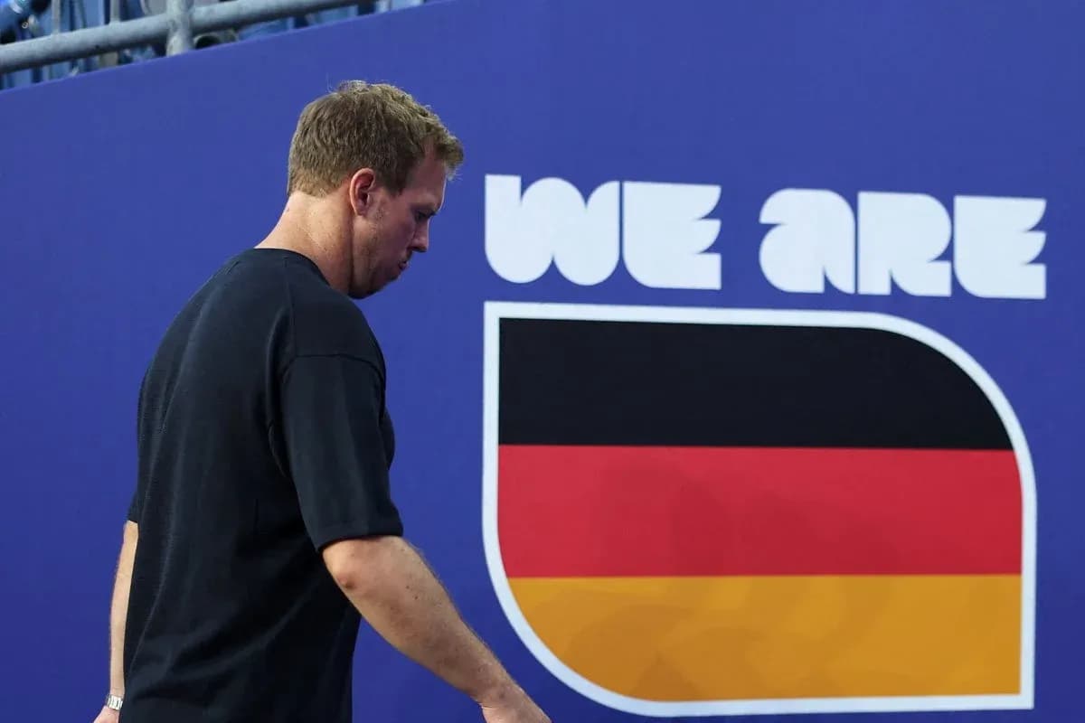 Athlete walking past 'We Are Germany' sign Athlete walking past 'We Are Germany' sign