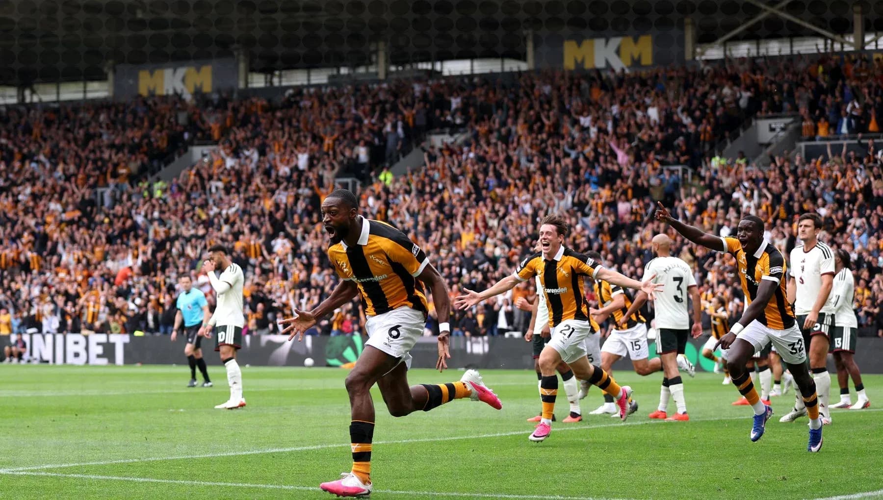 Hull City players celebrating a goal in stadium Hull City players celebrating a goal in stadium