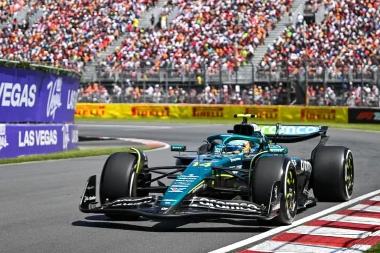 Formula 1 car racing on track with spectators Formula 1 car racing on track with spectators