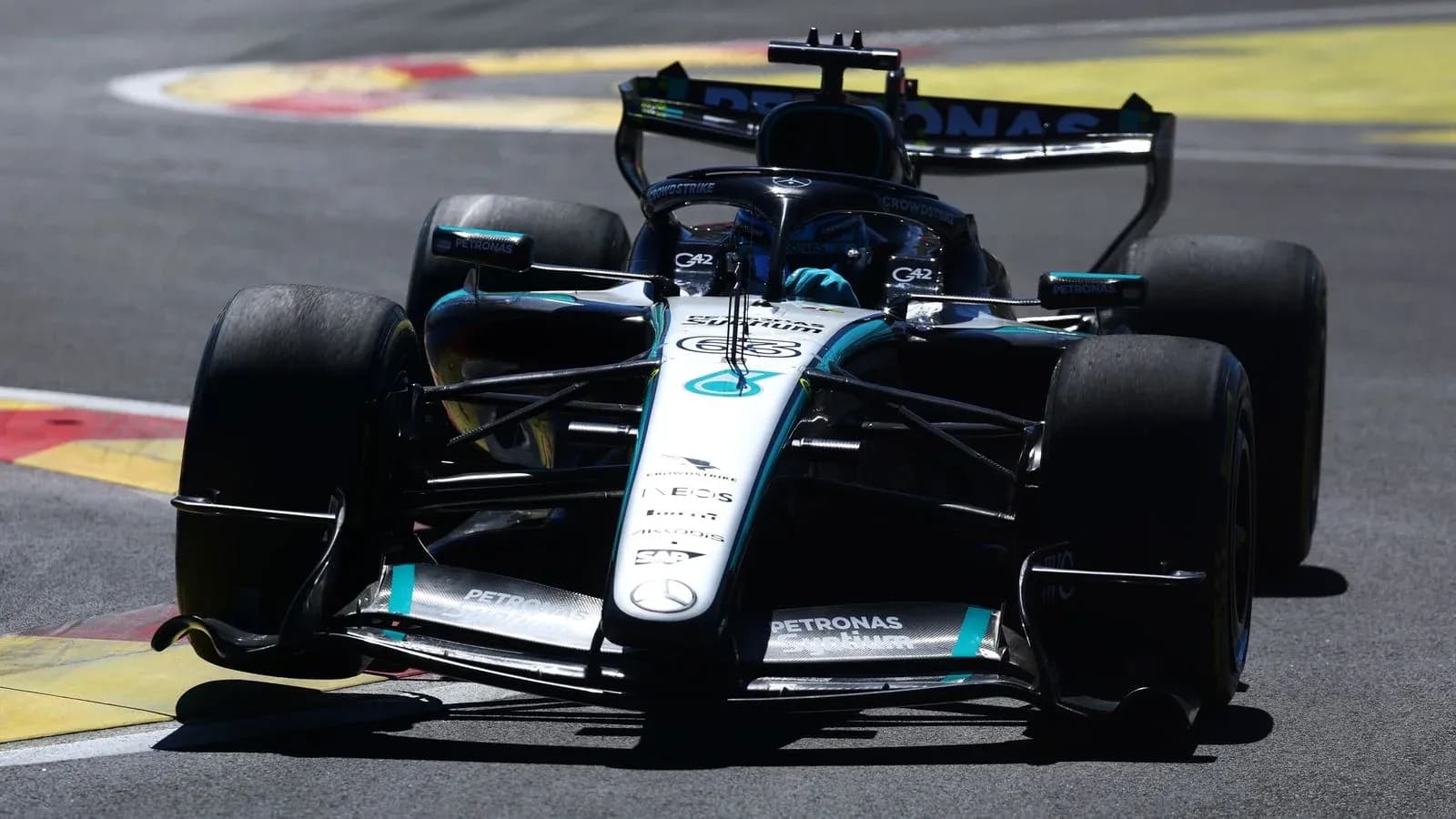 Formula 1 car racing on track during competition Formula 1 car racing on track during competition