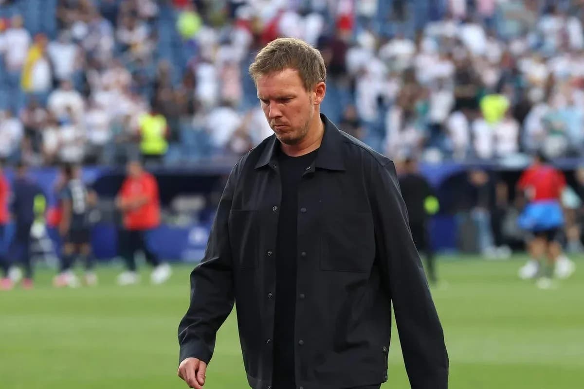 Coach walking on the pitch after the match Coach walking on the pitch after the match