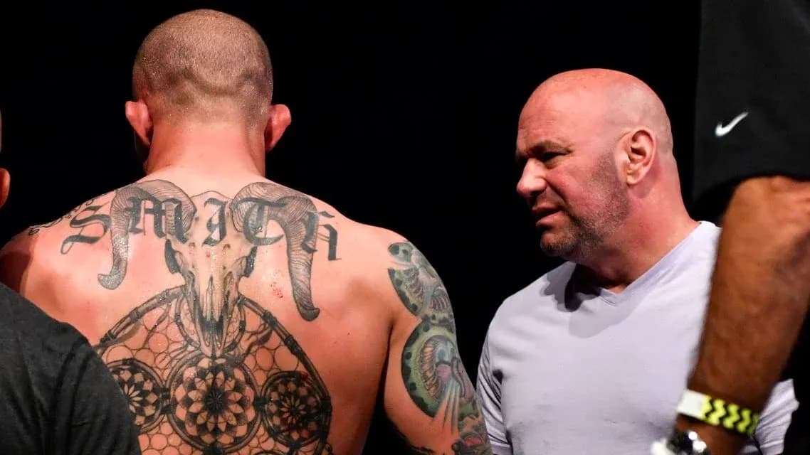 Fighter with tattoos talking to UFC official Fighter with tattoos talking to UFC official