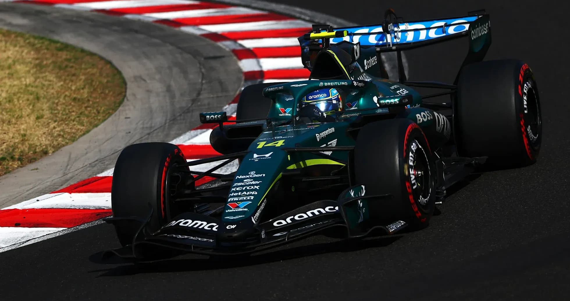 Formula 1 car navigating a corner on track Formula 1 car navigating a corner on track
