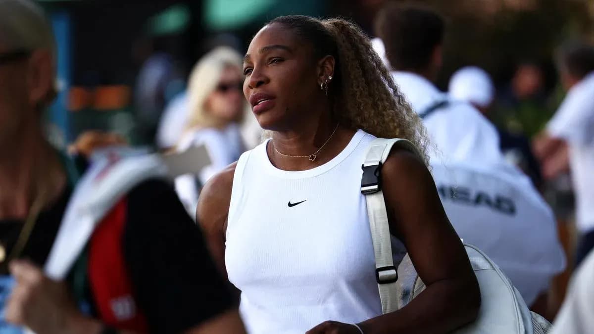 Tennis player walking with a bag in crowd Tennis player walking with a bag in crowd