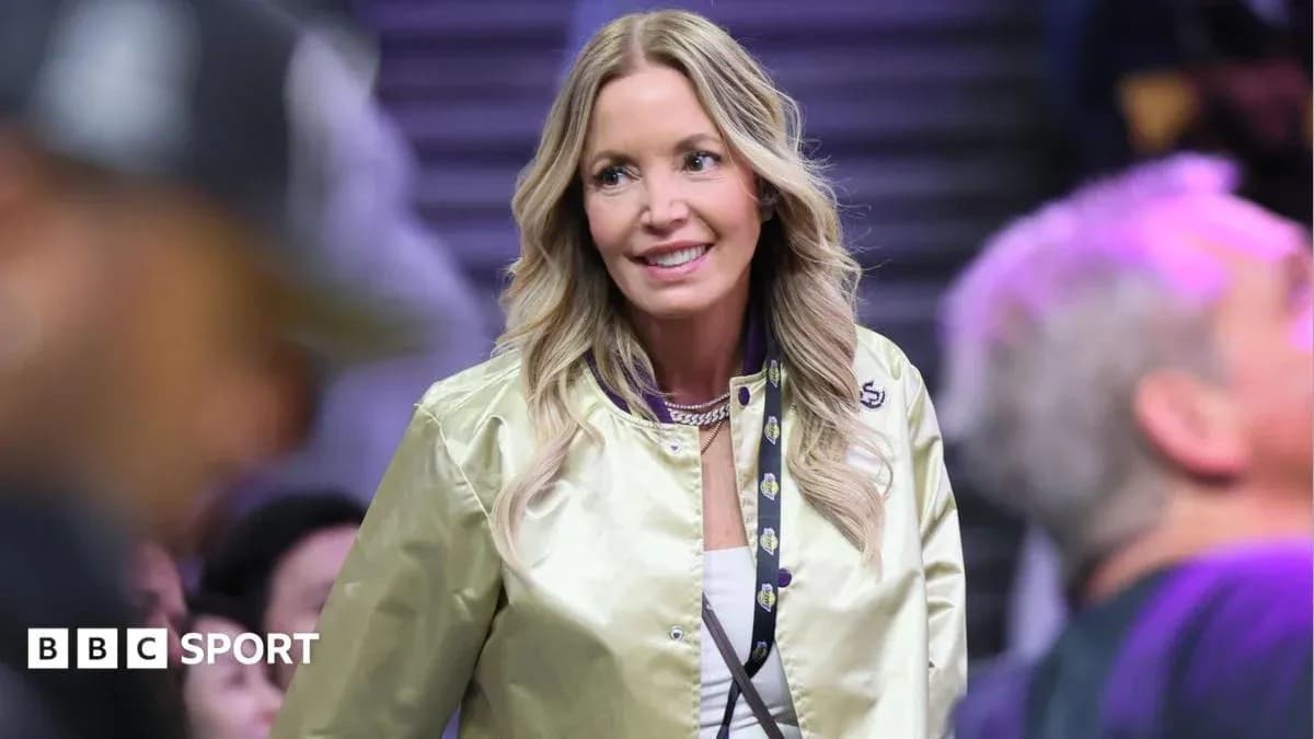 Woman in gold jacket at basketball game Woman in gold jacket at basketball game