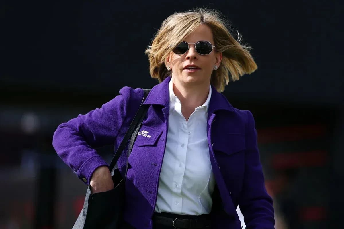 Woman in purple jacket walking with bag Woman in purple jacket walking with bag