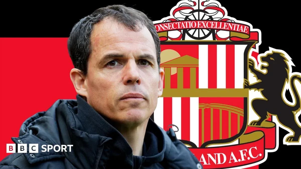 Sunderland AFC manager with club logo background Sunderland AFC manager with club logo background
