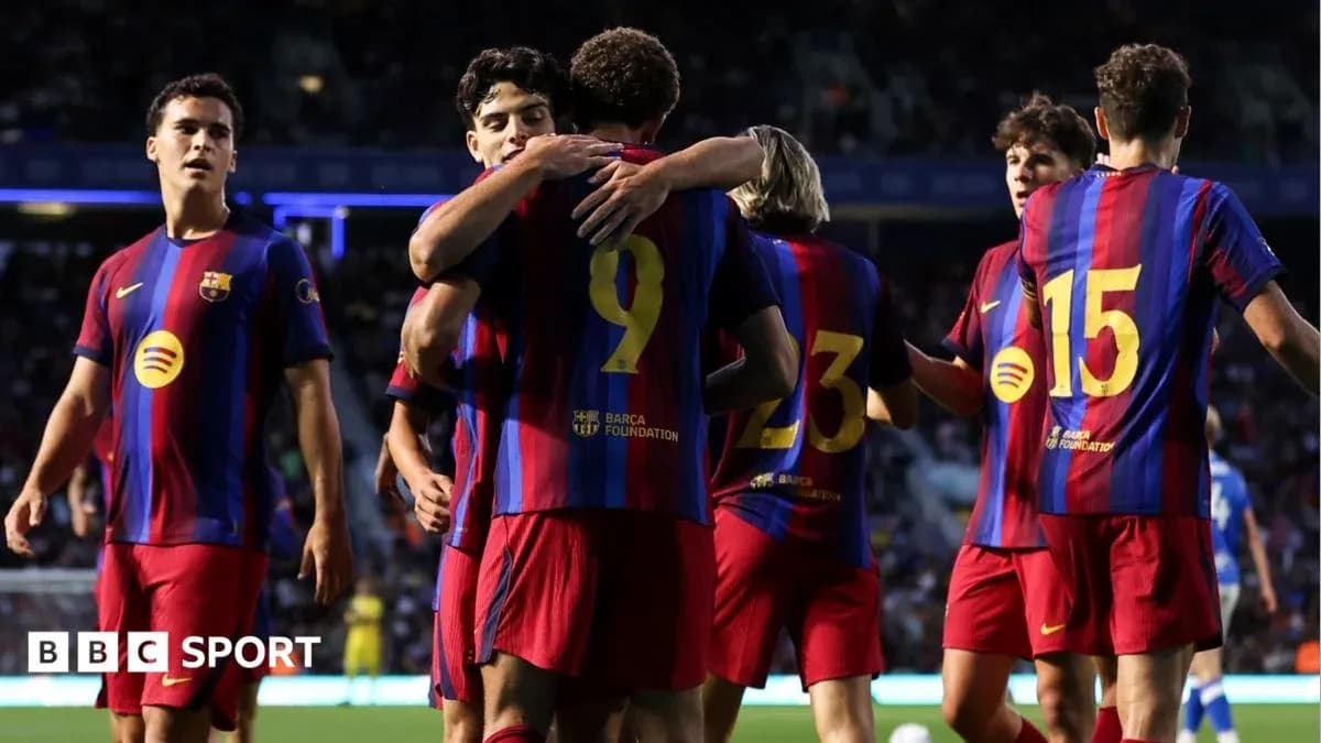 Barcelona players celebrating a goal on the pitch Barcelona players celebrating a goal on the pitch