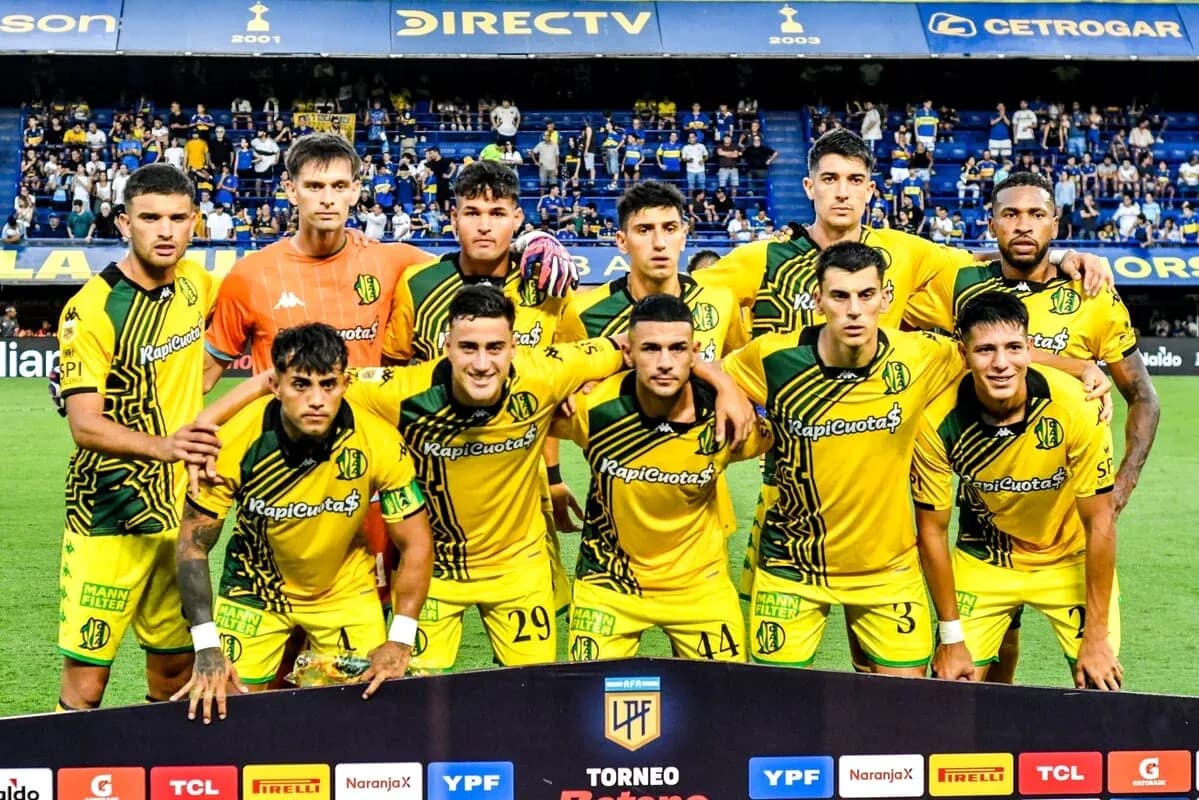 Football team posing for group photo before match Football team posing for group photo before match
