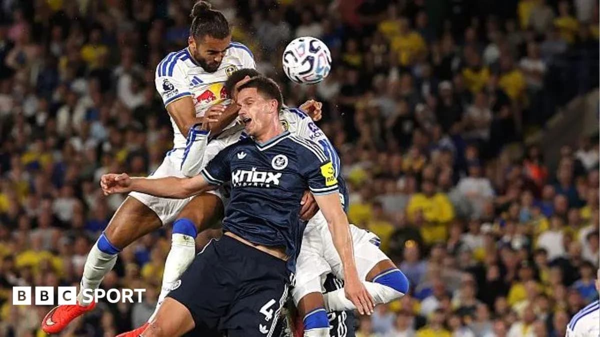 Two players challenging for the ball during match Two players challenging for the ball during match