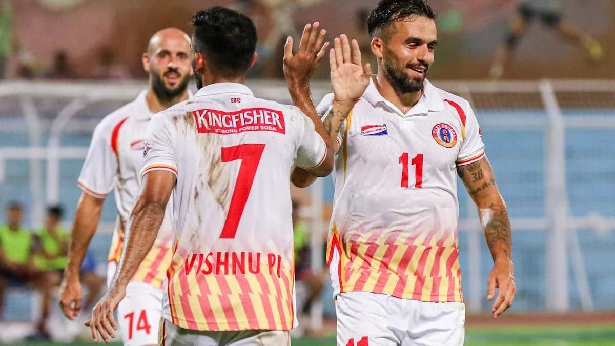 Football players celebrating a goal during match Football players celebrating a goal during match