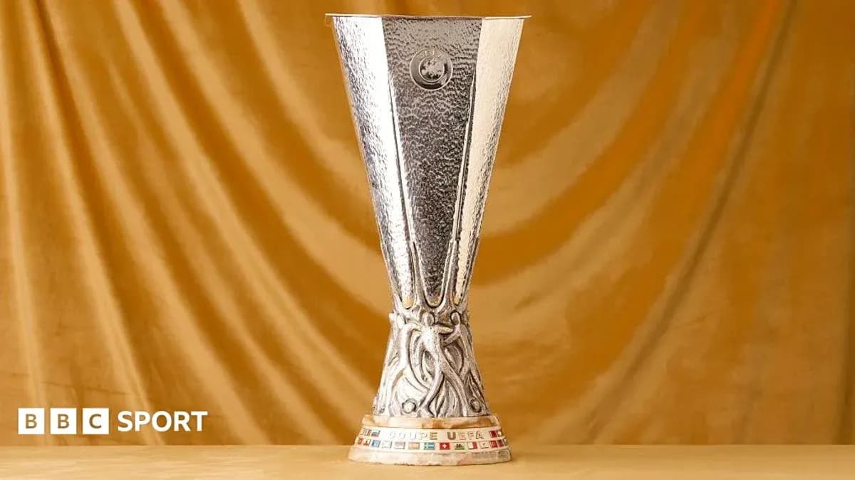 UEFA Europa League trophy on golden background UEFA Europa League trophy on golden background